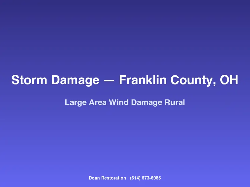 Large-area wind damage across a rural Franklin County property with downed trees damaged outbuildings and torn siding