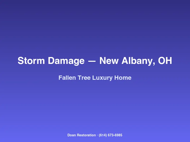 Large heritage oak tree fallen across the roof and detached garage of a New Albany luxury home after straight-line winds